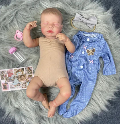 nukkuva tyttö Reborn nukke sinisessä mekossa